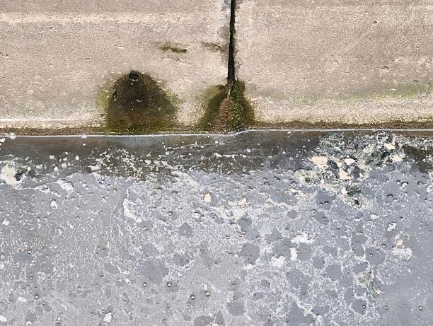 Sewage flows into the river. Pollution of the river