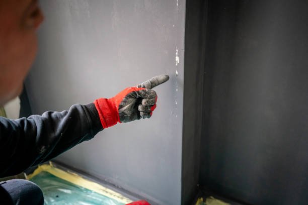 male painter is sign to wall horizontal fixer upper home still